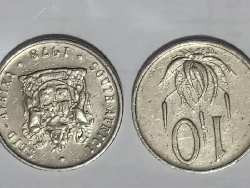 Dual sides : obverse + reverse of 1978 10 cent coins on grey surface