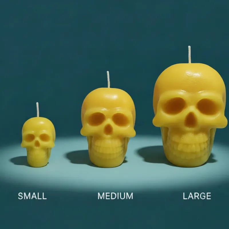 Three yellow skull-shaped candles of different sizes on a blue background