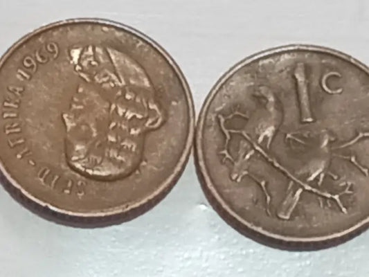 Two one cent 1969  Presidential series coins on a white background