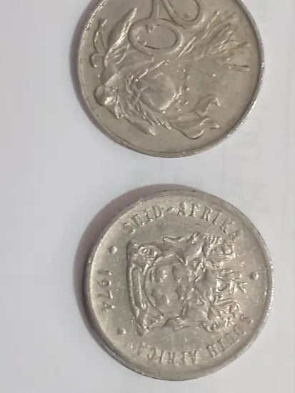 Two 1974 20 cent coins on a white background
