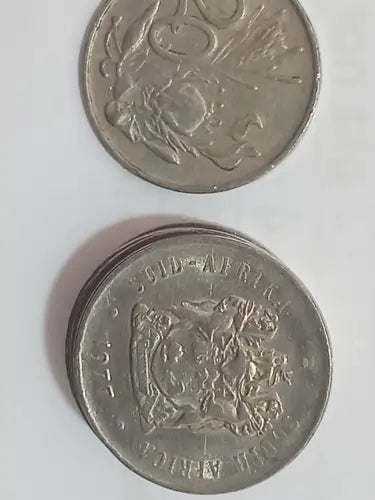 Two 1977 20 cent coins on a white background