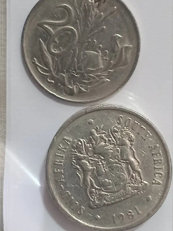 Two 1981 20 cent coins on a white background