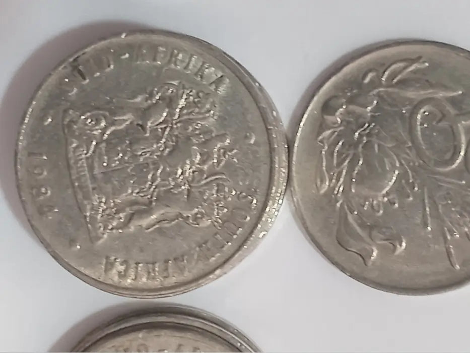 Two 1984 20c coins with on a white background