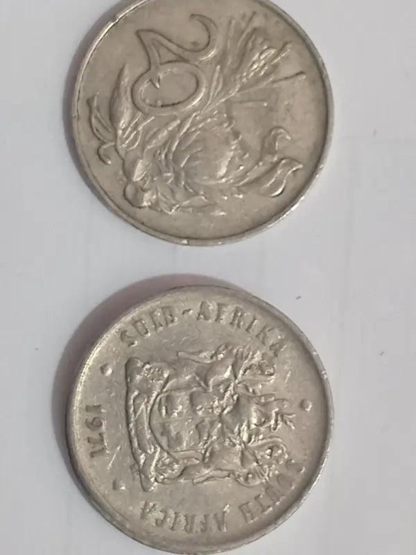 Two 1971 20 cent coins on light grey background