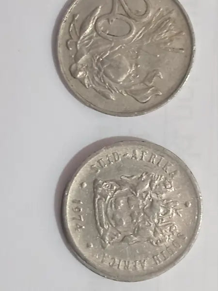 Two 1974 20 cent coins on a white background