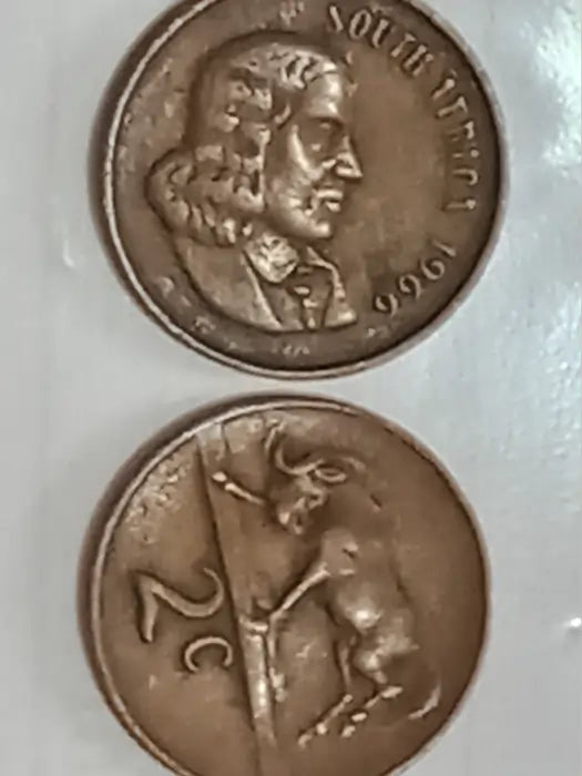 Two 1966 - 2 Cent Presidential series bronze coins on a white background