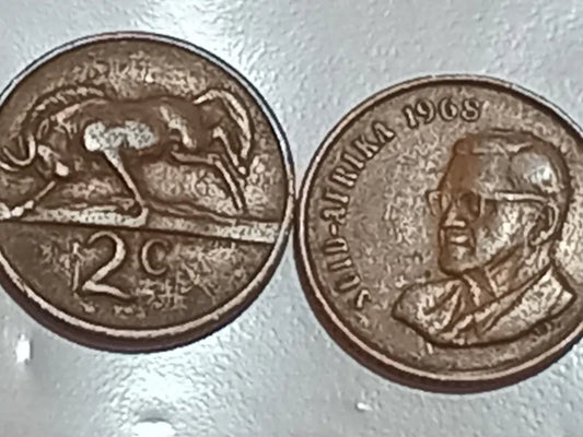 Two 1968 2 Cent presidential series coins on a white background.