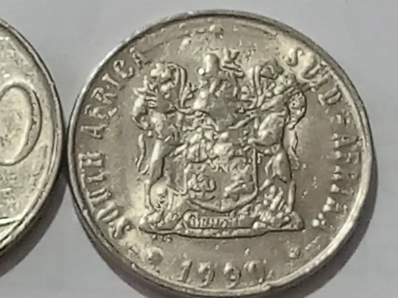 1990, 50 cent  coin with South African coat of arms on a gray background