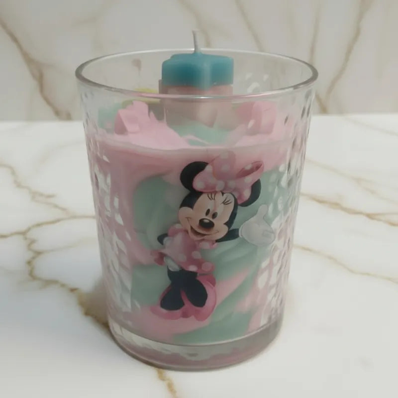 External: Glass candle with Minnie Mouse design. Internally:  PINK and lime candle swirl design with two bling stars, three mini pink swirls and fine grain wax to texturize the candle top as LAVA debris, creating the illusion of the stars emanating from inside the candle.