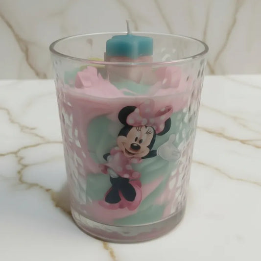 External: Glass candle with Minnie Mouse design. Internally:  PINK and lime candle swirl design with two bling stars, three mini pink swirls and fine grain wax to texturize the candle top as LAVA debris, creating the illusion of the stars emanating from inside the candle.