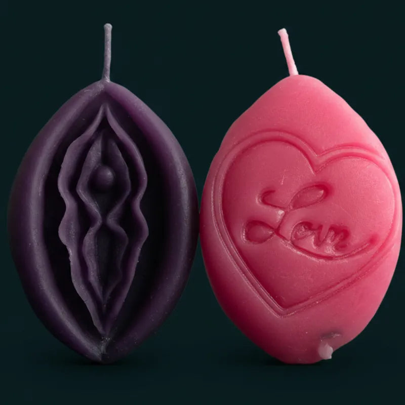 Two V-SPOT candles with intricate designs in pink and purple showing front and reverse of every candle in this range being dual sided.