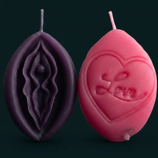 Two V-SPOT candles with intricate designs in pink and purple showing front and reverse of every candle in this range being dual sided.