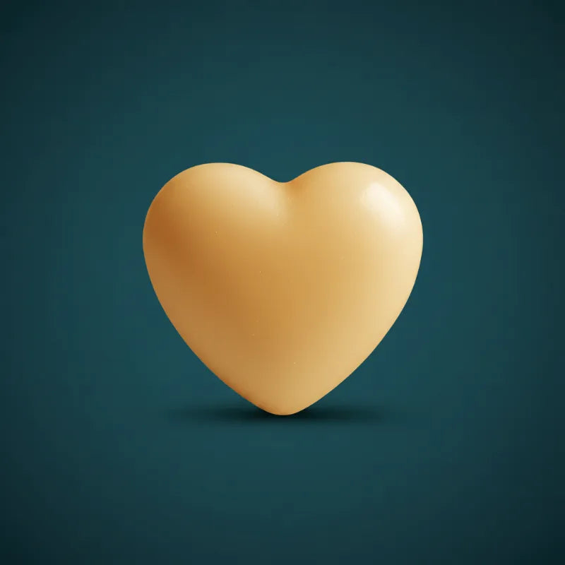 Gold heart-shaped wax candle on dark teal background – LAVA Heart Candle