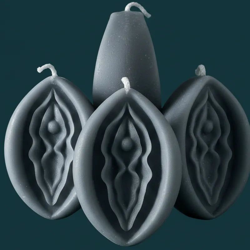 light grey V-SPOT candles with intricate designs on a dark background