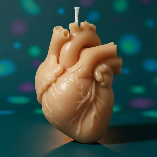 Beige color heart candle