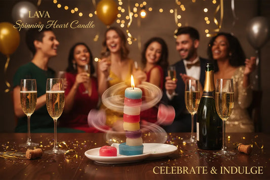 Group of people celebrating with champagne and a colorful candle, LAVA Spinning Heart Candle displayed.