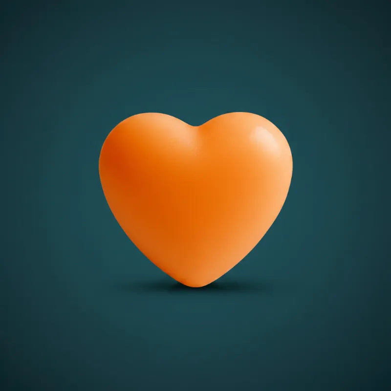 Orange heart-shaped wax candle on dark teal background – LAVA Heart Candle