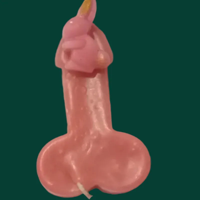 Rocket mode peachy.beige variant resembling a male reproductive organ on a green background