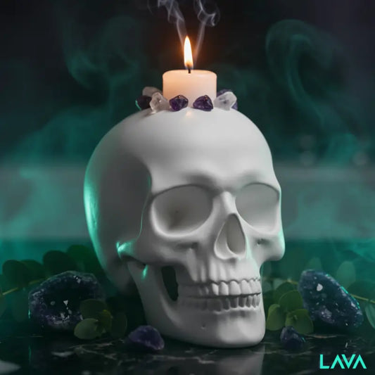 LAVA iconic Skull-shaped candle holder with a lit candle and crystals from the LAVA ROX RANGE on a dark background 